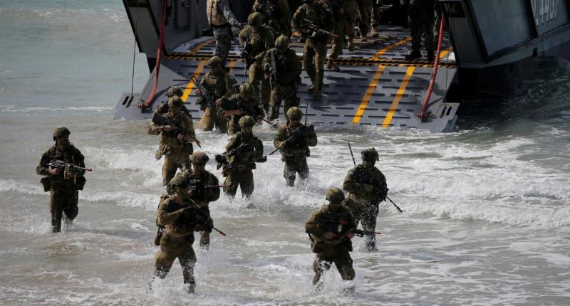 Soldiers from the Australian Army's 3rd Brigade conduct an amphibious assault landing on Langham Beach during the Talisman Saber joint military exercises between Australia and the United States in Queensland on July 13, 2017.
