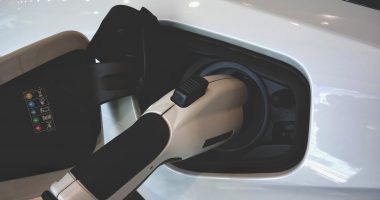 An electric car charger at work powering up an EV vehicle