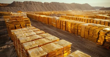 Image of gold bars in the desert.