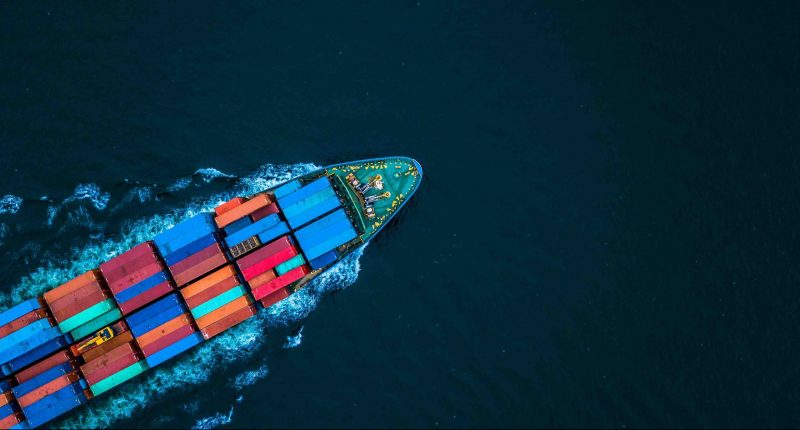 Aerial view from drone, Container ship or cargo shipping business logistic import and export freight transportation by container ship in open sea, Container loading cargo freight ship boat