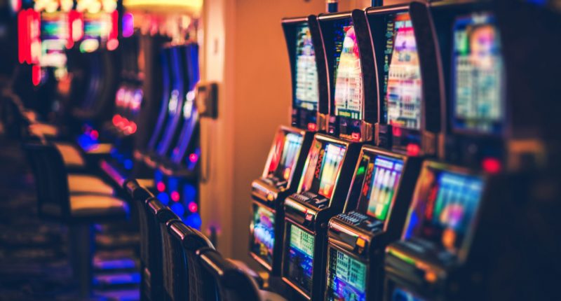 Rows of Casino Slot Machines with Shallow Depth of Field. Las Vegas Gambling Theme.