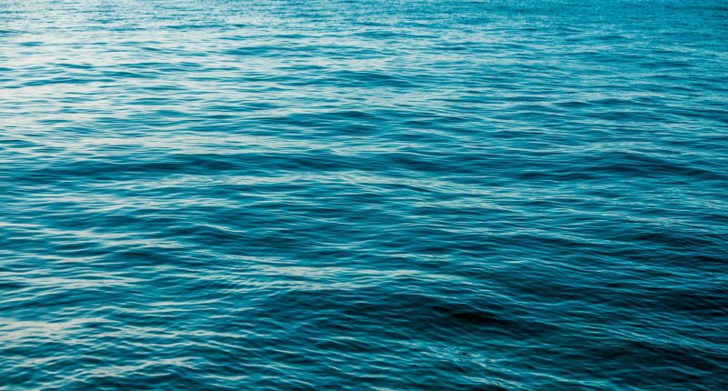 Deep Blue and Calm Sea Surface Nature Background