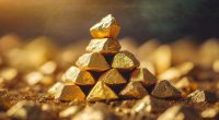 Stacked gold nuggets, golden space, close-up