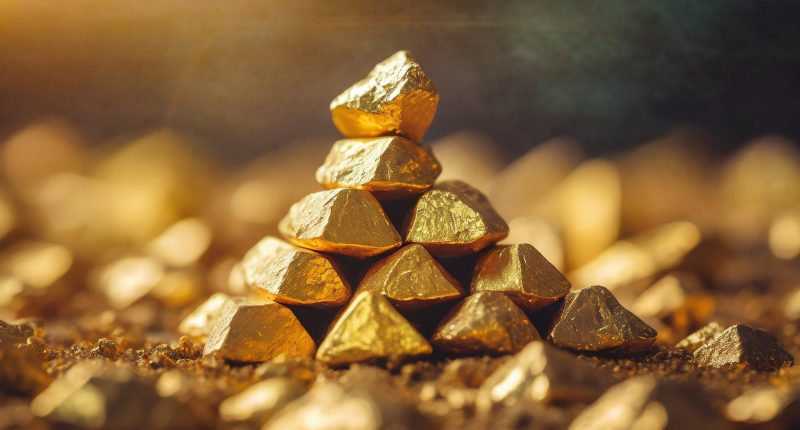 Stacked gold nuggets, golden space, close-up