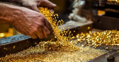 Image of man pouring out gold chips.
