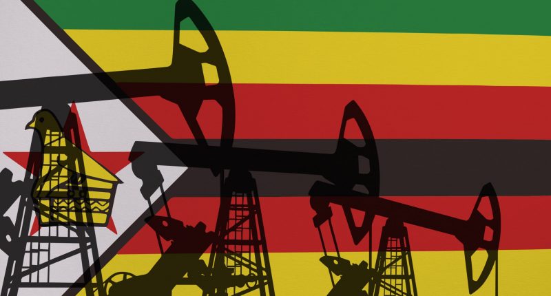 Pump- jacks on background in colors of national flag. Oil and gas wells production concept. Zimbabwe