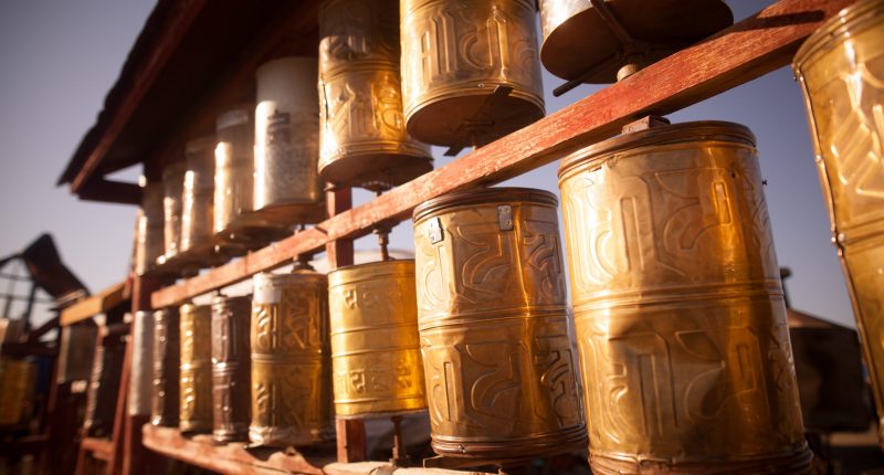 Spinning Buddhist prayer drums at a monastery in Mongolia.