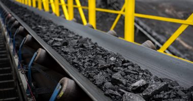 Image of a conveyor belt of coal