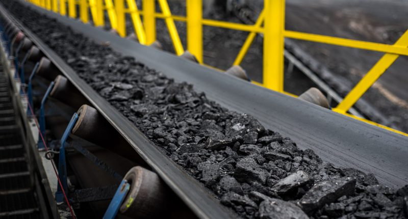 Image of a conveyor belt of coal