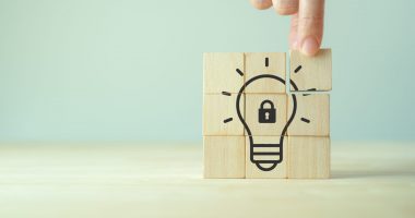 Image of a lightbulb design on a wooden block