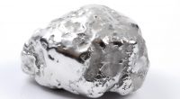 One shiny silver nugget on white background