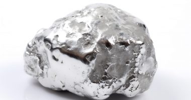 One shiny silver nugget on white background