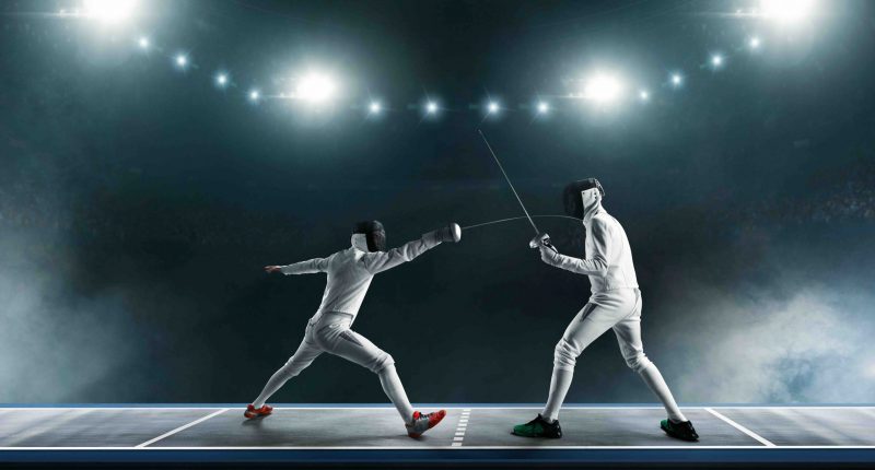 Two men fencing