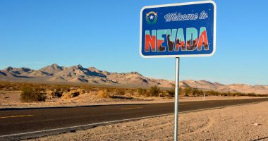 Welcome to Nevada road sign along a highway.