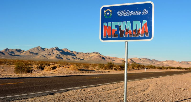 Welcome to Nevada road sign along a highway.