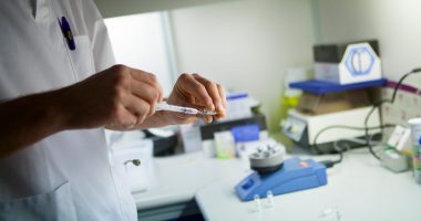 Image of a researcher testing a drug