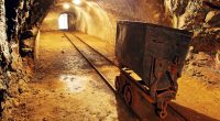 Underground train in mine, carts in gold, silver and copper mine