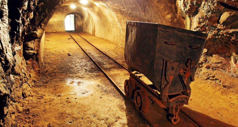 Underground train in mine, carts in gold, silver and copper mine