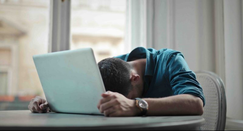 Man in despair at laptop