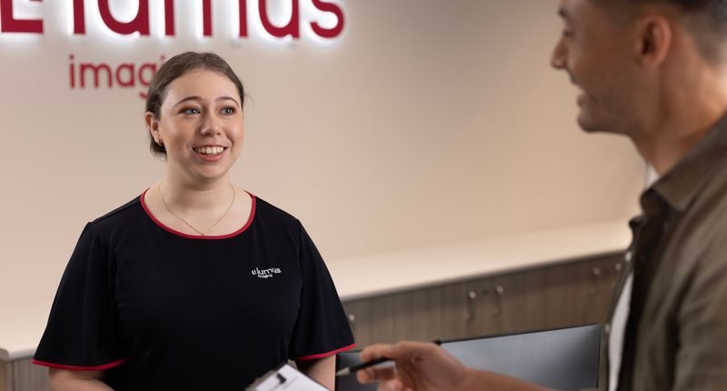 Lumus Imaging staff member greeting patient