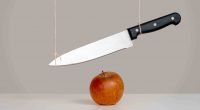 A sword dangles above your head in this case a crisp apple