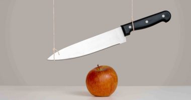 A sword dangles above your head in this case a crisp apple