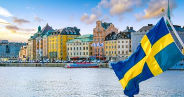 Image of a Swedish flag waving in Stockholm