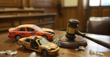 Image of two model cars on a courthouse desk