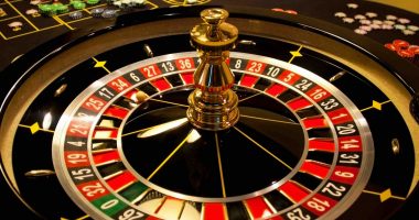 A roulette wheel with the classic black and red design.