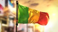 Mali flag against a city backdrop