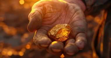 Hand holding gold nugget