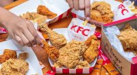 KFC chicken and chips on a table.