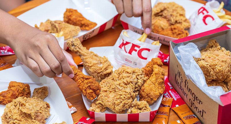 KFC chicken and chips on a table.