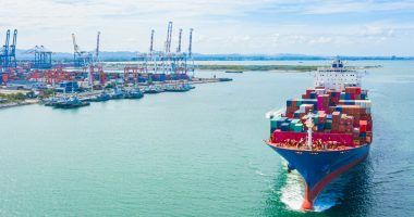 A cargo ship comes into port.