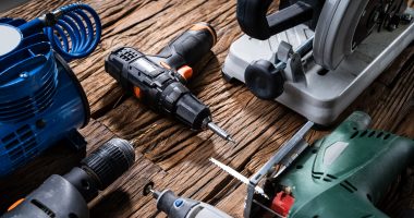 Power tools on a wooden surface