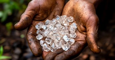 Image of a man holding diamonds