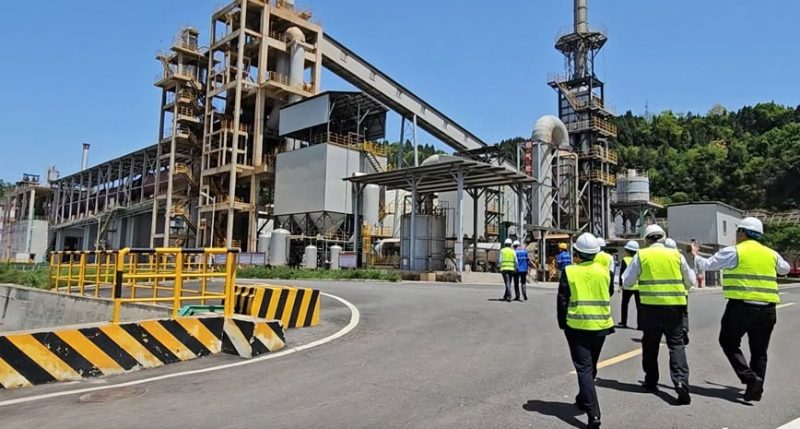 Lithium Universe workers inspect a Chinese lithium production site.