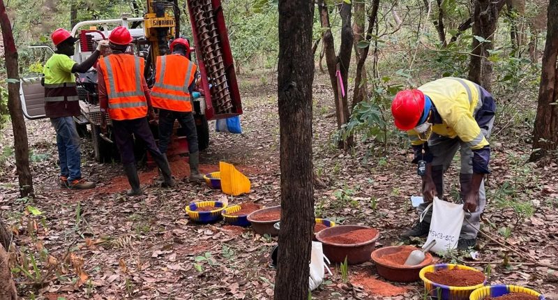 Several Many Peaks Minerals workers check through buckets at the Ferke Gold Project.