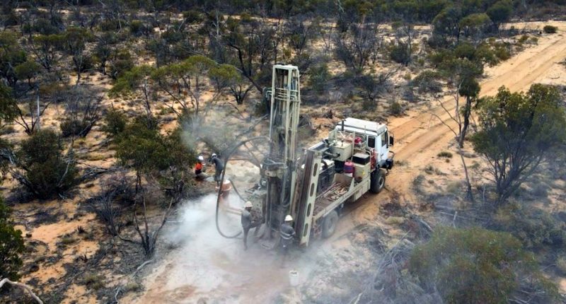 A truck drives through a Metal Hawk mining project.