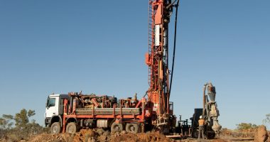 A mining truck with a long construction haul at the back