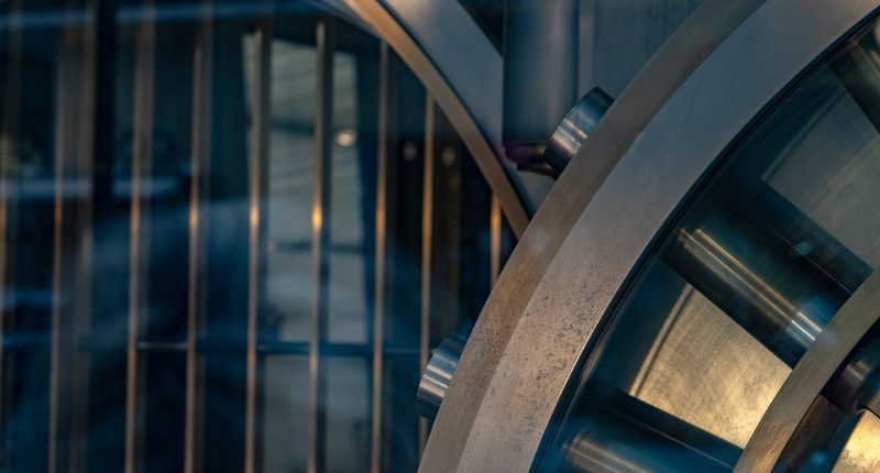 Safe strongbox with bank vault details.