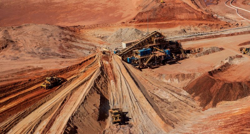 Several trucks and rigs working at the Cataby mine owned by Iluka Resources