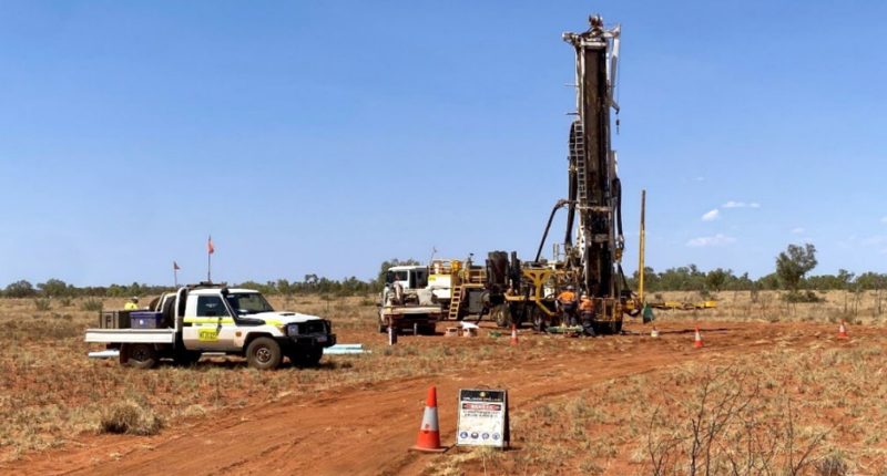 Trucks and rigs at the Dixon Well Project.
