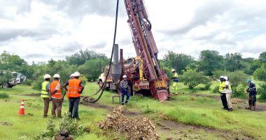Haranga Resources workers watching a rig installed at the California project.