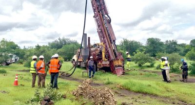 Haranga Resources workers watching a rig installed at the California project.