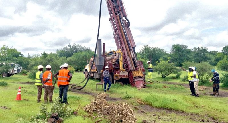 Haranga Resources workers watching a rig installed at the California project.