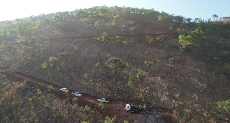 Rigs driving up a mountain road at the Step Aside lithium project.