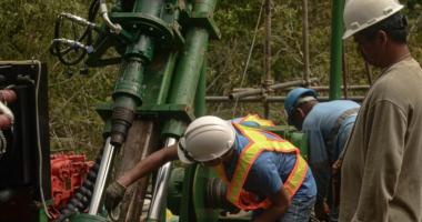 Celsius Resources workers set up a drilling exploration rig at MCB Project.