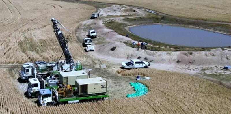 Trucks and workers at the Gilmore project owned by Linq Minerals