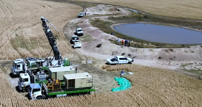 Trucks and workers at the Gilmore project owned by Linq Minerals